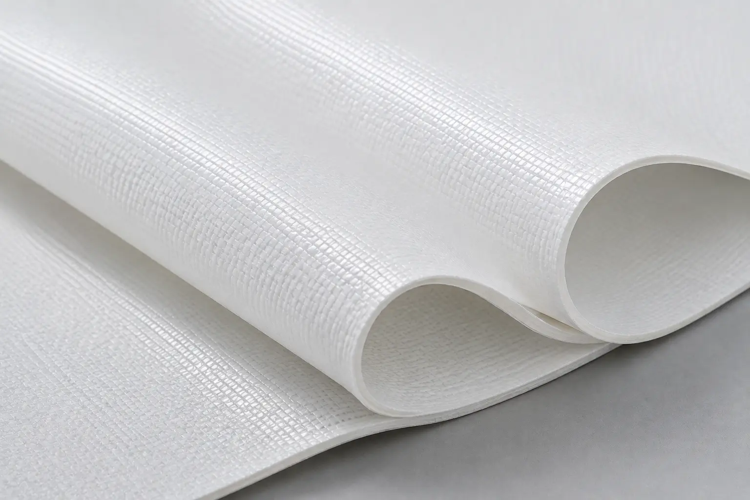 PTFE-coated glass-fibre membrane: a matte white sheet with a fine woven grid visible through the coating