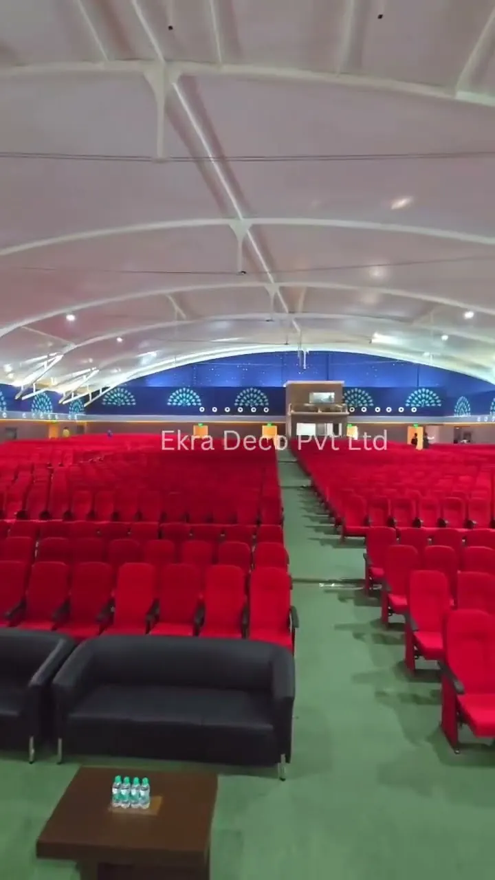 Tensile membrane barrel-vault ceiling over an auditorium, seen from the rear of the seating