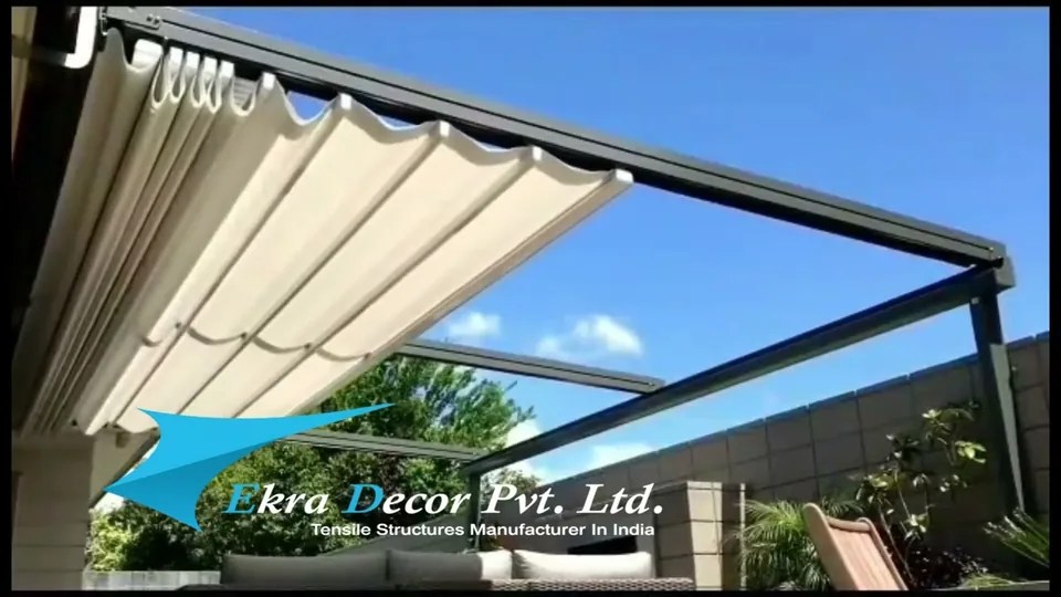 Retractable fabric pergola folding open over a patio